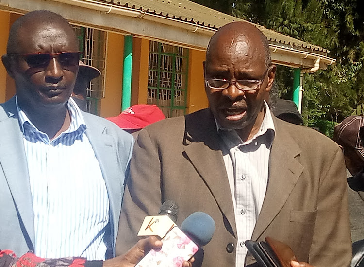 Moiben MP Sila Tiren and Kenya Farmers Association director Kipkorir Menjo in Eldoret