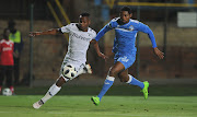 Nelson Ogbonnaya of Enyimba challenges Thobani Mncwango of Bidvest Wits during the CAF Confederation Cup match between Bidvest Wits and Enyimba FC on 06 April 2018 at Bidvest Stadium.