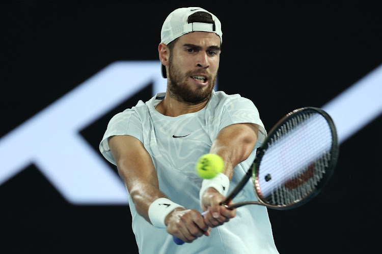 Karen Khachanov of Russia plays a backhand in his quarterfinal against Sebastian Korda of the US on day nine of the 2023 Australian Open at Melbourne Park on January 24 2023.