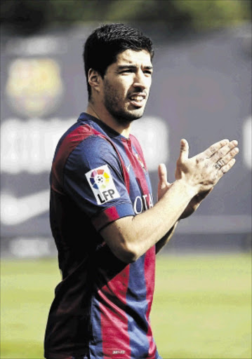 CHEERY: Luiz Suarez of Barcelona PHOTO: Gustau Nacarino/ REUTERS