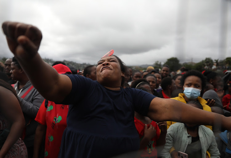 Excited EFF supporters during an address by party leader Julius Malema at the party's election rally at Inanda Comprehensive School sports ground.