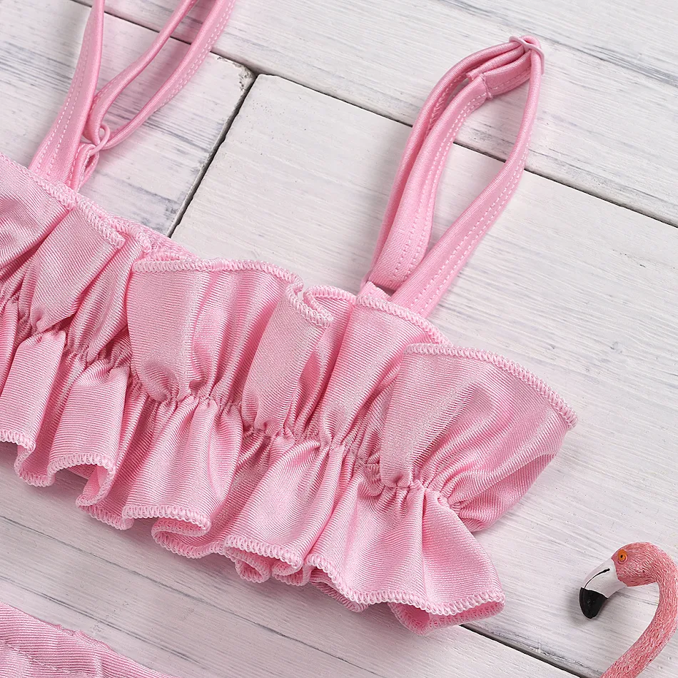 Robe pour filles avec jupe plissée bicolore en résille élastique. Idéale pour la danse, les fêtes et un look élégant et confortable.