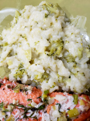 Cheesy broccoli rice with grilled salmon