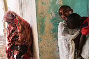 Refugees from the Tigray region of Ethiopia wait to receive medical attention in Sudan.