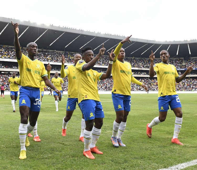 Mamelodi Sundowns players celebrate with Cassius Mailula after his goal against Orlando Pirates during their DStv Premiership match at the Orlando Stadium