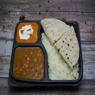 Chole, Kadhai Paneer, Tawa Roti (4), Rice, Salad & Raita Thali