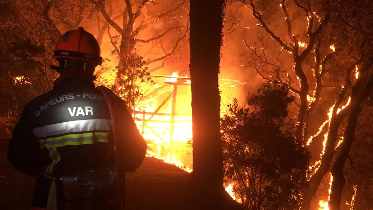 A firefighter works near at the site of a wildfire that broke out in the Var region of southern France, August 17 2021.Picture: ROMAIN PESCHEL SDIS/REUTERS