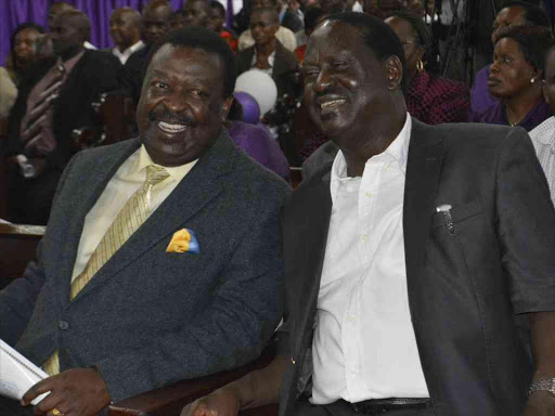 Cord leader Raila Odinga with Amani National Congress Musalia Mudavadi at St Stephens Church Jogoo Road on April 24,2016.Photo Emmanuel Wanson