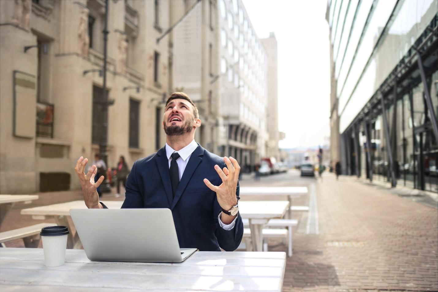 A person sitting at a table with a computer

Description automatically generated with medium confidence