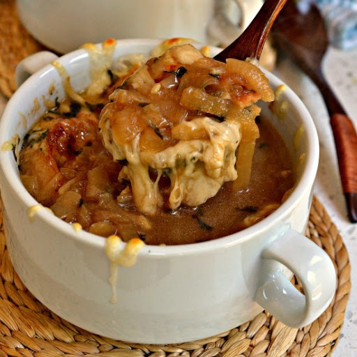 Slow cooked onions are cooked to perfection, then simmered in broth and spice, and topped with toasted crostini and rich Gruyere cheese!