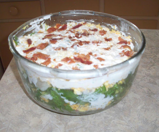 Company's Coming multi-layered salad.  Love this salad.  Looks great in a fancy bowl and goes a long way.