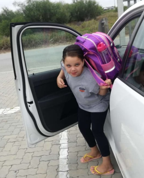 RARING TO GO: Jazmine Sharpley, 8, arrives at her school, Elliot Academy