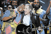 BOYS IN THE BUBBLE: Joseph Shabalala of Ladysmith Black Mambazo and Paul Simon in Washington in 2007 Picture: GETTY IMAGES