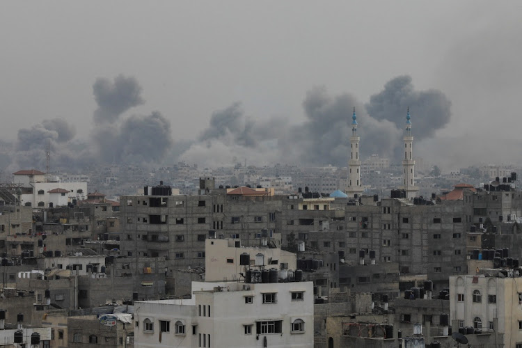 Plumes of smoke rise during Israeli strikes on Gaza City, October 29 2023. Picture: JOSHUA NOTT/ REUTERS