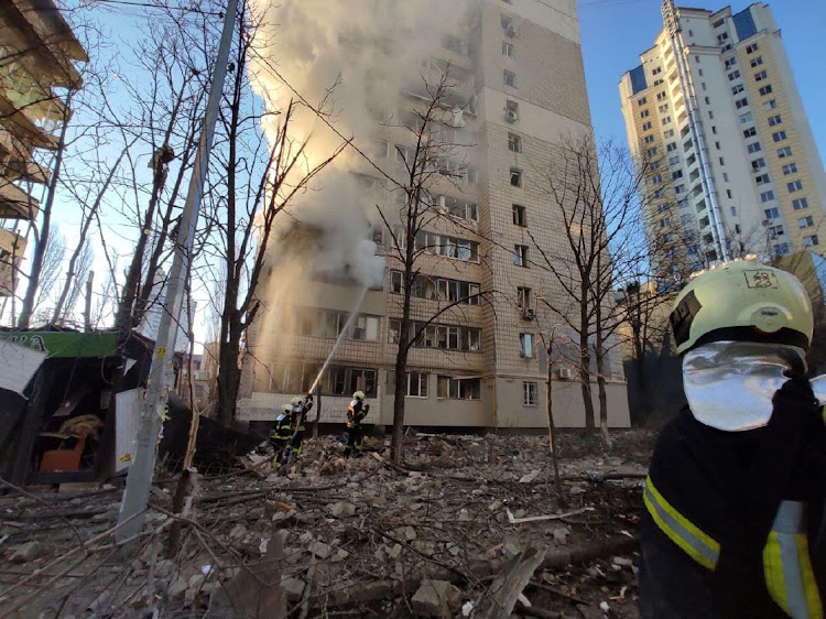 Rescuers work next to a residential building damaged by shelling, as Russia’s attack on Ukraine continues, in Kyiv, Ukraine, in this handout picture released on March 16 2022. Picture: STATE EMERGENCY SERVICE OF UKRAINE/HANDOUT VIA REUTERS