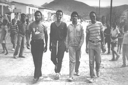 Fort Calata, second from right, and Matthew Goniwe, far right, two of the Cradock Four who were murdered by security police in 1985, are accompanied home by two activists after being released from detention in 1984. Archive image