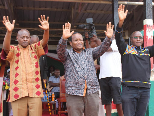 From left Nyeri governor Mutahi Kahiga, Nyeri Town MP Ngunjiri Wambugu and Nyeri Speaker John Kaguchia at 61st Commemoration of Dedan Kimathi’s execution (Dedan Kimathi Day) at Kamukunji stadium, Nyeri town on Sunday.