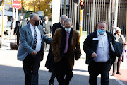 Anton Pretorius and Willem Coetzee with their legal team at the High Court in Pretoria. Simelane disappeared in 1983 after she was abducted and tortured by police. 