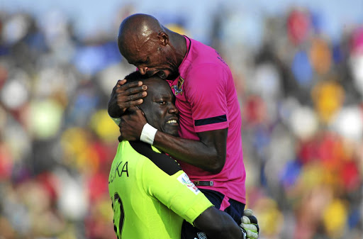 Black Leopards' players Rotshidzwa Muleka, left, and Jean Munganga celebrate winning promotion back to the Premiership.