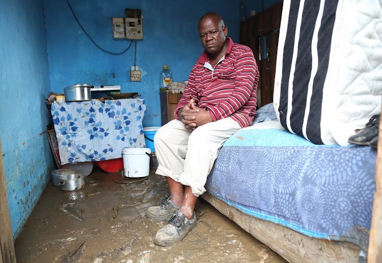 Mondli Cele in his KwaMashu home that was flooded during the recent storm.