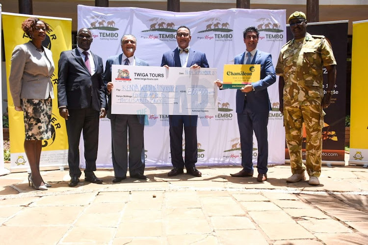 Kenya Tourism Board CEO Betty Addero, Ministry of Tourism and Wildlife PS Fred Segor, Ministry of Tourism and Wildlife CS Najib Balala and KWS DG John Waweru receive donations from Twiga Tours CEO Minaz Manji and Twiga tours Sales and marketing manager Rahim Manji at KWS Headquarters Nairobi National park on 14 September 2021./MERCY MUMO