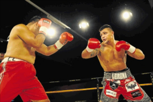 SHORT-CHANGED: Kevin Lerena, right, slug it out with Javier Corrales recently PHOTO: Gallo Images