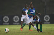 Sandile Gamedze of Eswatini challenged byt Thabo Mafatle of Lesotho during a Cosafa Cup match at King Zwelithini Stadium in Umlazi on Sunday.