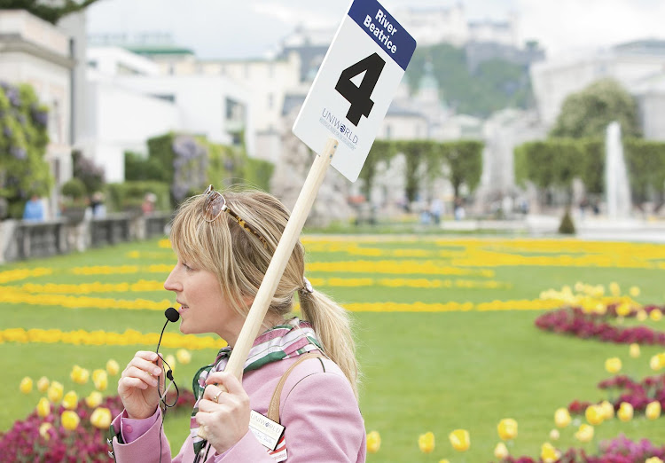 A guide in Salzburg, Austria, talks with her tour participants.