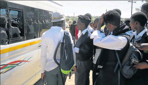 IN THE QUEUE: Ngwenyathi High School pupils get ready to board their ride home outside the school. Picture: MICHAEL PINYANA