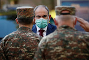 Armenian Prime Minister Nikol Pashinyan visits the Central Clinical Military Hospital of the Armenian Defense Ministry, where servicemen wounded during the military conflict over the breakaway region of Nagorno-Karabakh are treated, in Yerevan, Armenia October 23, 2020. 