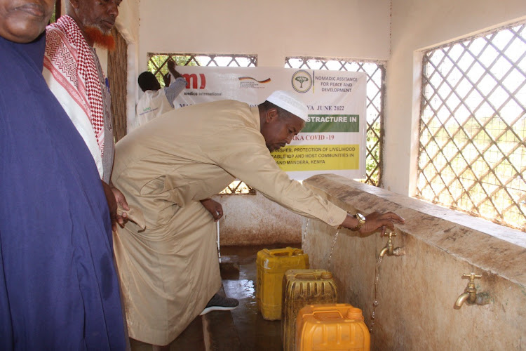 Muslim clerics fetching water at the Mandera Integrated Islamic Centre on Monday