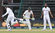 Dean Elgar and Rassie van der Dussen run between the wickets during day four of the Test match between SA and India at the Wanderers on Thursday.