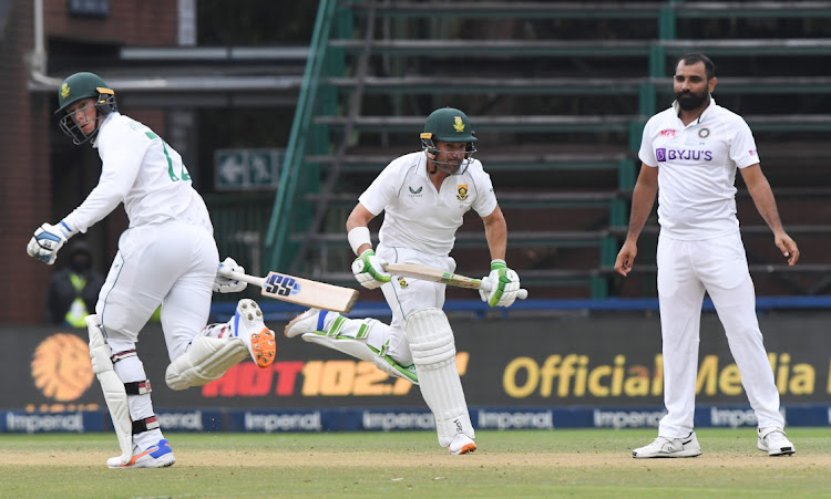 Dean Elgar and Rassie van der Dussen run between the wickets during day four of the Test match between SA and India at the Wanderers on Thursday.