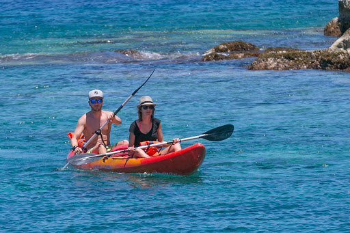 guadeloupe-kayaking.jpg - A couple kayaks in the aquamarine waters of  Îles des Saintes, Guadeloupe, in the Caribbean.