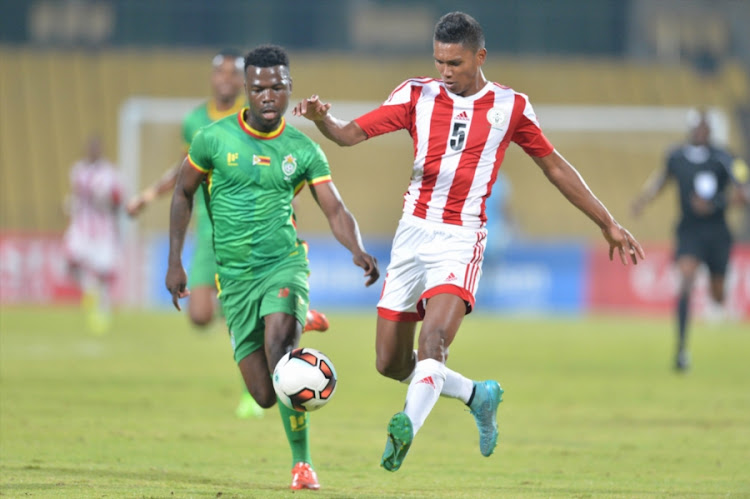 Knox Mutizwa of Zimbabwe and Andoniaina Andrianina of Madagascar during the COSAFA Cup match between Zimbabwe and Madagascar at Royal Bafokeng Stadium on June 28, 2017 in Rustenburg, South Africa.