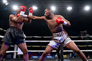 Former professional footballer Phikelelani Khumalo, right, and Thando Mali in action at Emperors palace where Khumalo won by a KO in round two.