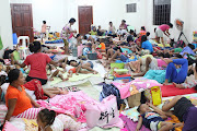 People are seen inside an evacuation centre in preparation for Typhoon Mangkhut in Cagayan, Philippines, in this September 13, 2018.