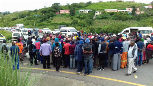 Angry villagers from around Majola in Port St Johns shutdown the R61 demanding a tar road on a 70 km gravel road that connects their homes to the national route. Picture: SIKHO NTSHOBANE