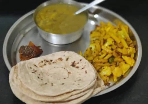 Dal [300 ML] Bhaat [500 ML] Roti [5] Bhujiya Papad Aur Achar