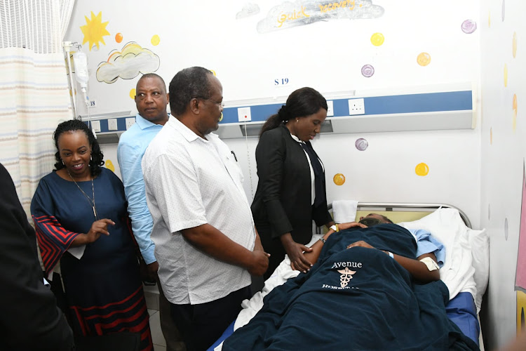 Higher Education and Research Principal Secretary Beatrice Inyangala interacts with of of the Kenyatta University students admitted following a road accident at Avenue Hospital on March 20, 2024.