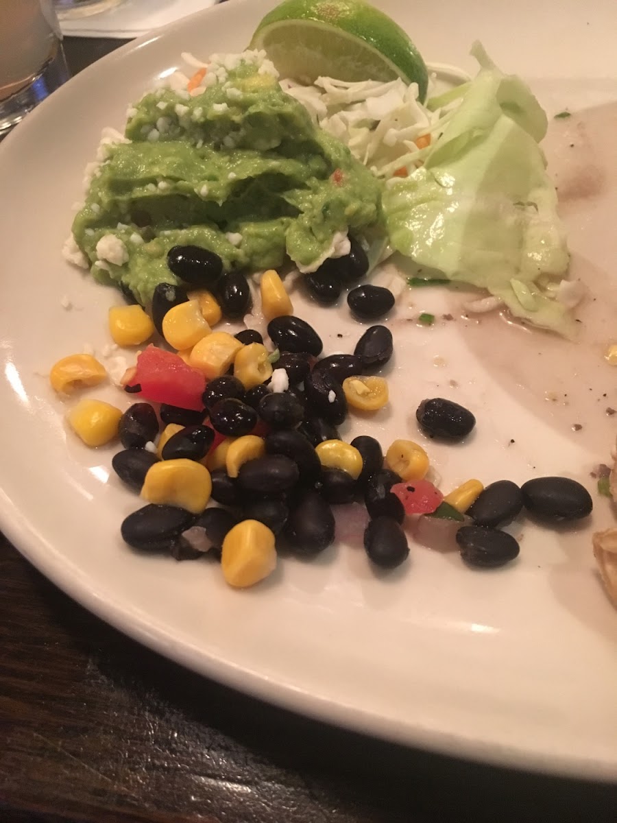 Chicken tacos said they can with beans and corn, and this is the sad portion I got