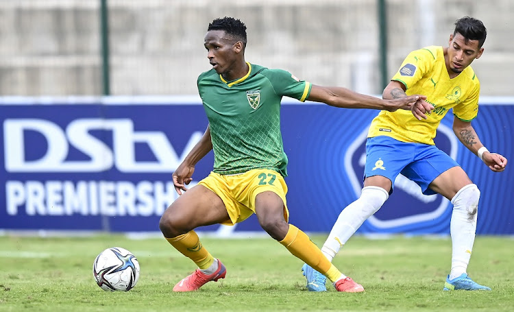 Simo Mbhele of Lamontville Golden Arrows brushes off Gaston Sirino of Mamelodi Sundowns in the DStv Premiership match at Sugar Ray Xulu Stadium on October 20 2021.