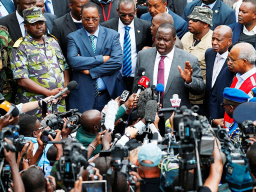 Internal Security CS Fred Matiang'i and other senior government officials address the press at the DusitD2 hotel in Riverside after the terrorists were neutralized ending the two day siege. January 16, 2019. Photo/Jack Owuor