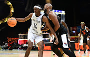Nkosinathi Sibanyoni of Cape Town Tigers challenged by Morakinyo Williams of Dynamo BBC during the 2024 BAL Season 4 match between Cape Town Tigers and Dynamo BBC at the SunBet Arena in Pretoria.
