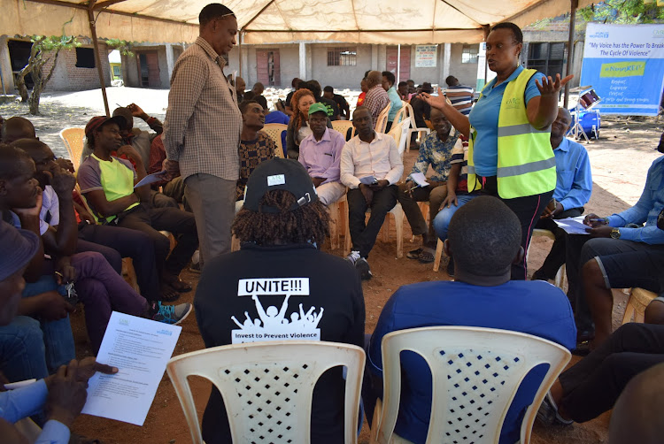 Gender activist Caroline Ndinya speaks during commuinity engagement with boda boda and tuk tuk operators at Shauri Yako estate in Homa Bay town on December 9,2023