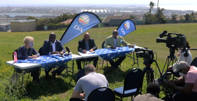 DA representatives, from left, Annette Lovemore, Nqaba Bhanga, Jonathan Lawack and Masixole Zinto speak to the media at the Glendinningvale reservoir in Port Elizabeth on Wednesday