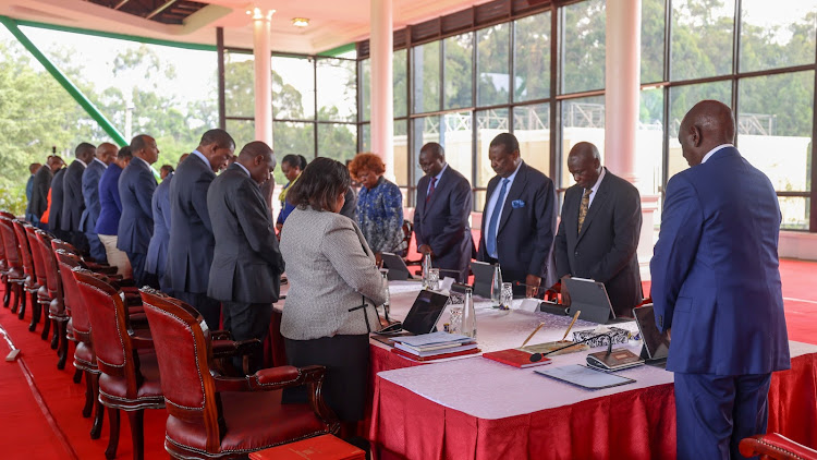 President William Ruto and Cabinet Secretaries praying before a cabinet meeting at State House, Nairobi on January 15, 2024