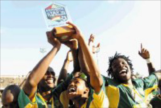 JUBILANT: Golden Arrows players celebrate after the team walloped Orlanod Pirates 3-0 in the Asiphephe Cup at Chatsworth stadium in Durban yesterday. Pic. Siyabonga Mosunkutu. © Sowetan.