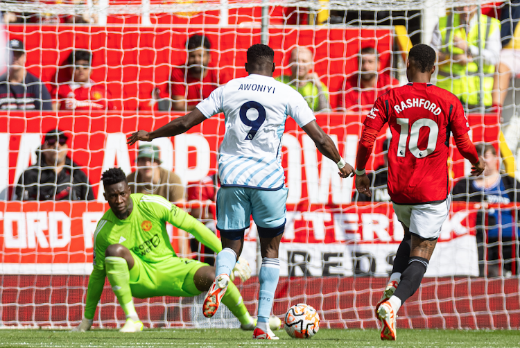 Nottingham Forest's Taiwo Awoniyi in action with Manchester United's Marcus Rashford and Andre Onana