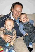 DAD: Gary Clarence with the twins, found dead with a sister in their London home, while he was in South Africa.